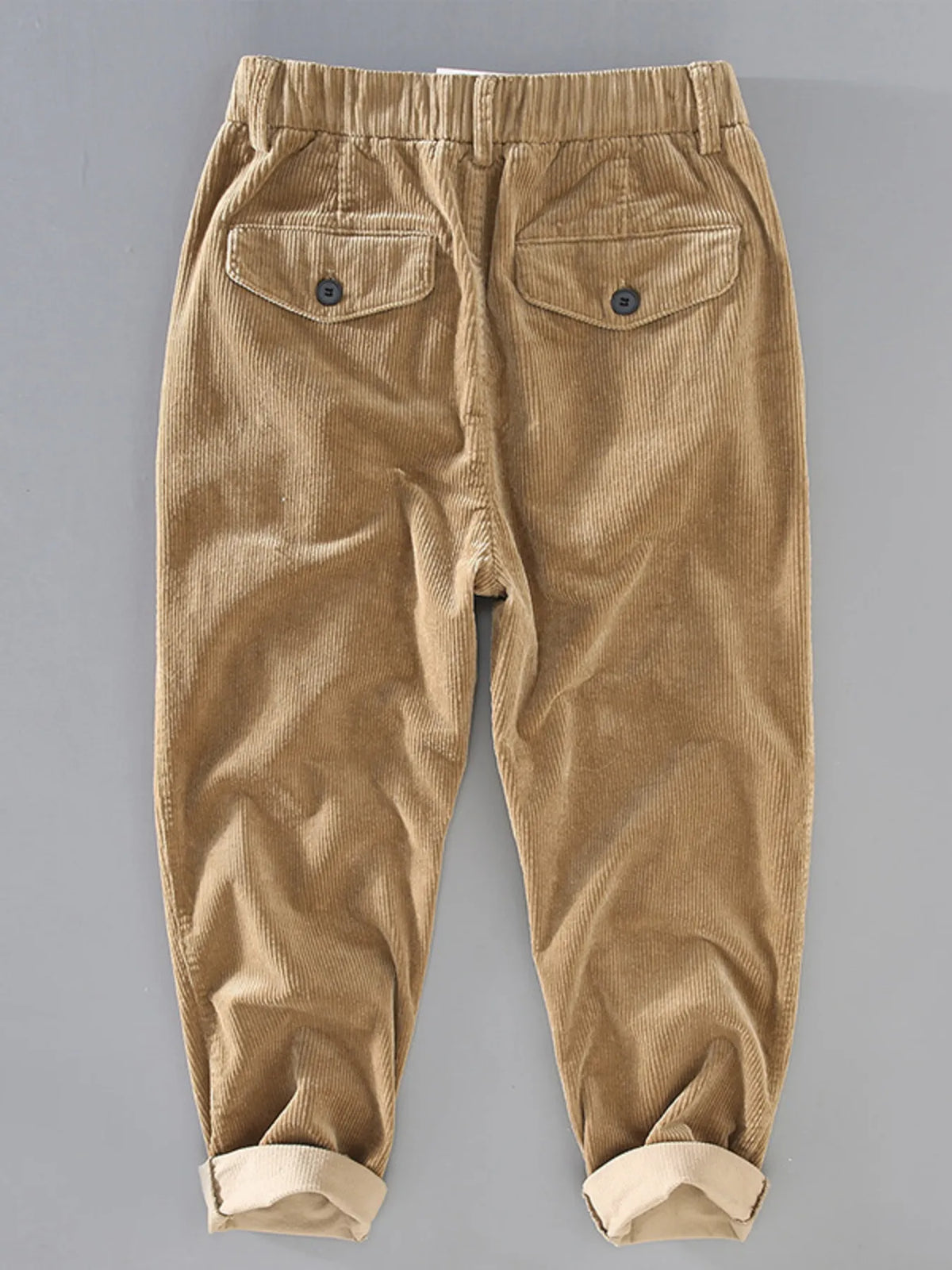 Rear view of beige corduroy jogger pants with elastic cuffs by Northvale.